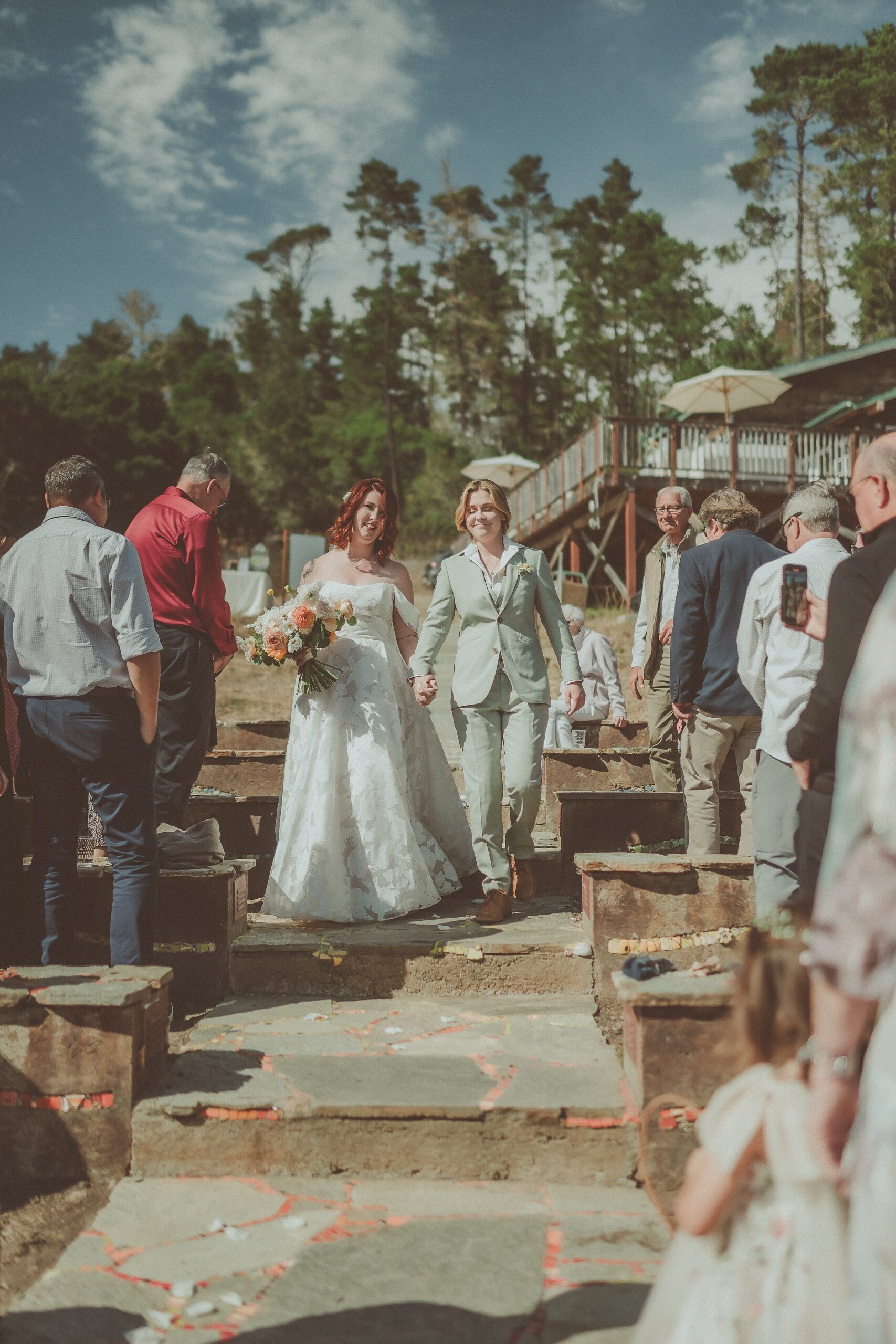 Couple Walking Down Aisle Together at Camp Ocean Pines Wedding