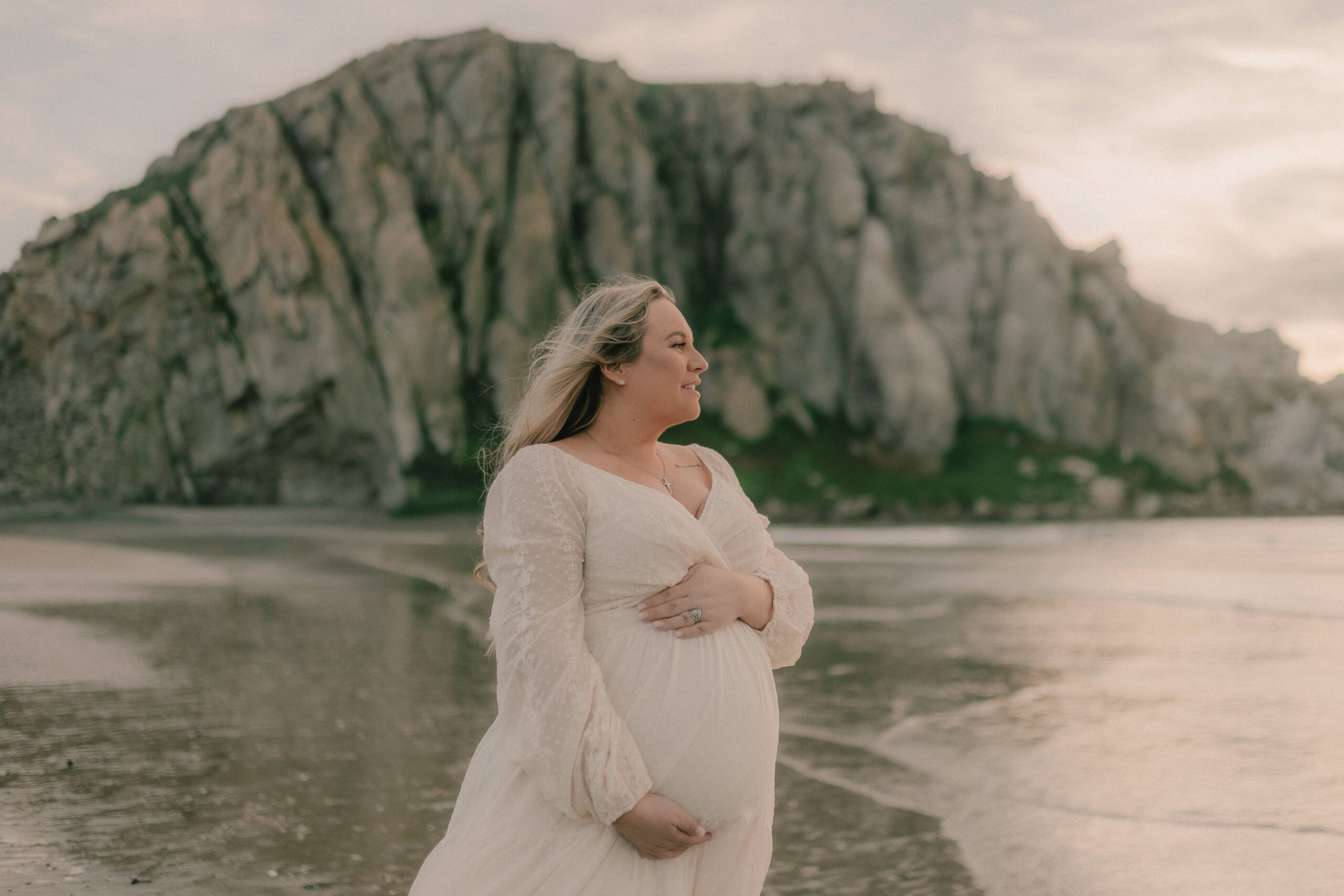 Maternity portrait beside a rocky Central Coast beach