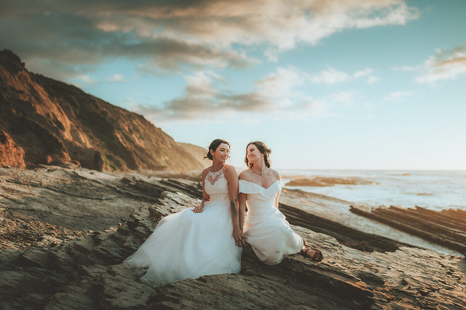 Two newlyweds in a wide Central Coast landscape