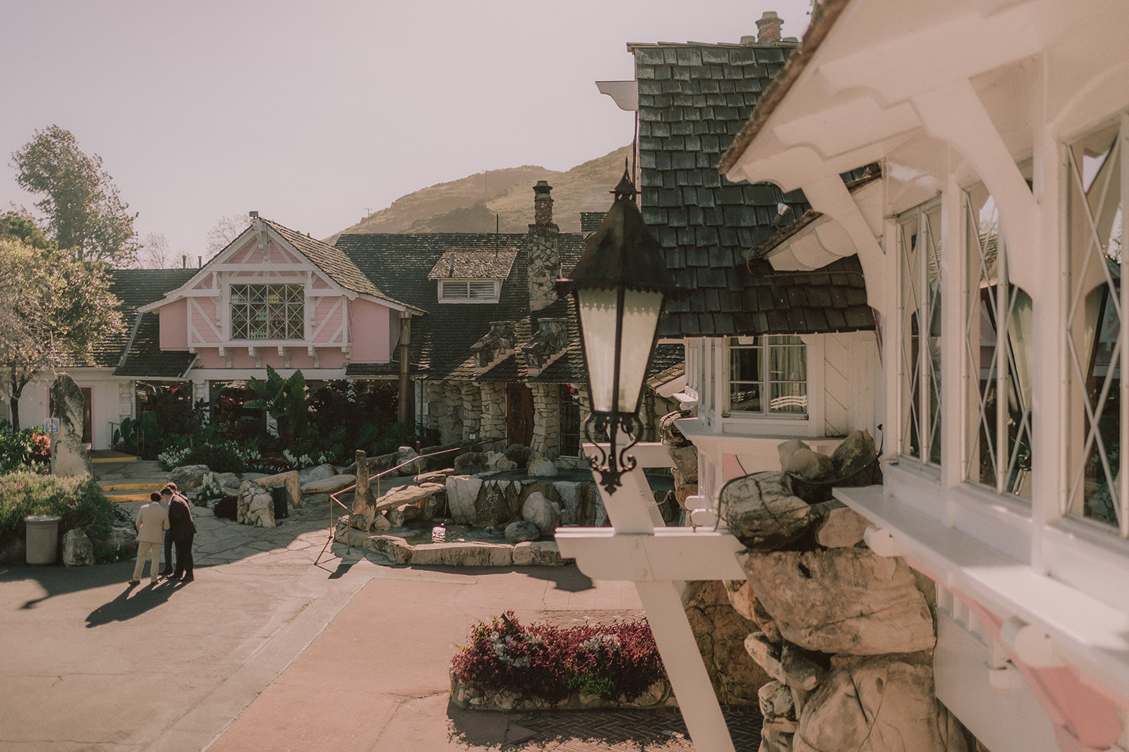 Wide exterior view of the Madonna Inn and its whimsical grounds
