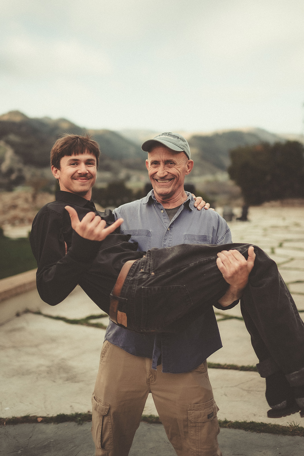 Playful family carry during an outdoor portrait session