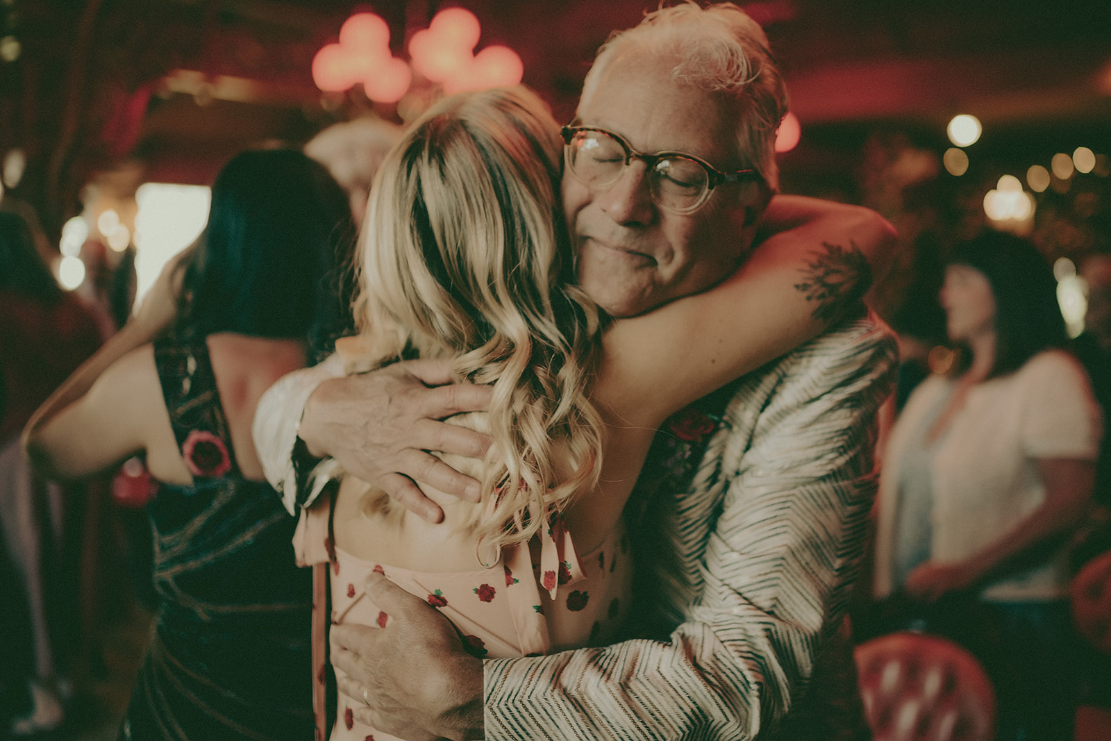 Emotional embrace between wedding guests