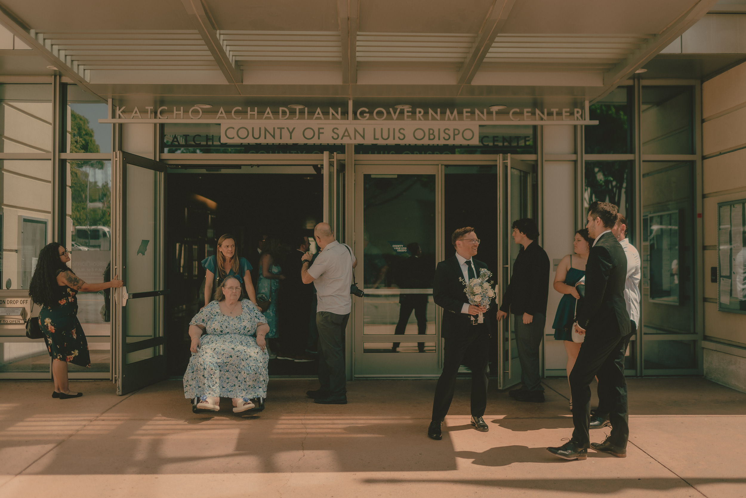 Guests gather outside the San Luis Obispo County Government Center.