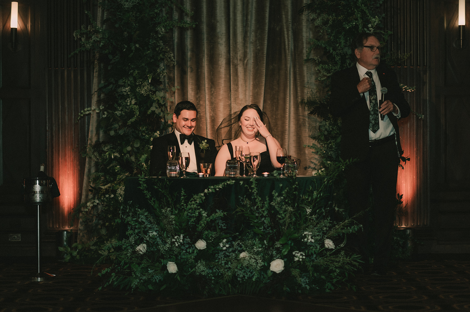 Anne laughs in her black second look beside Charles during a reception toast.