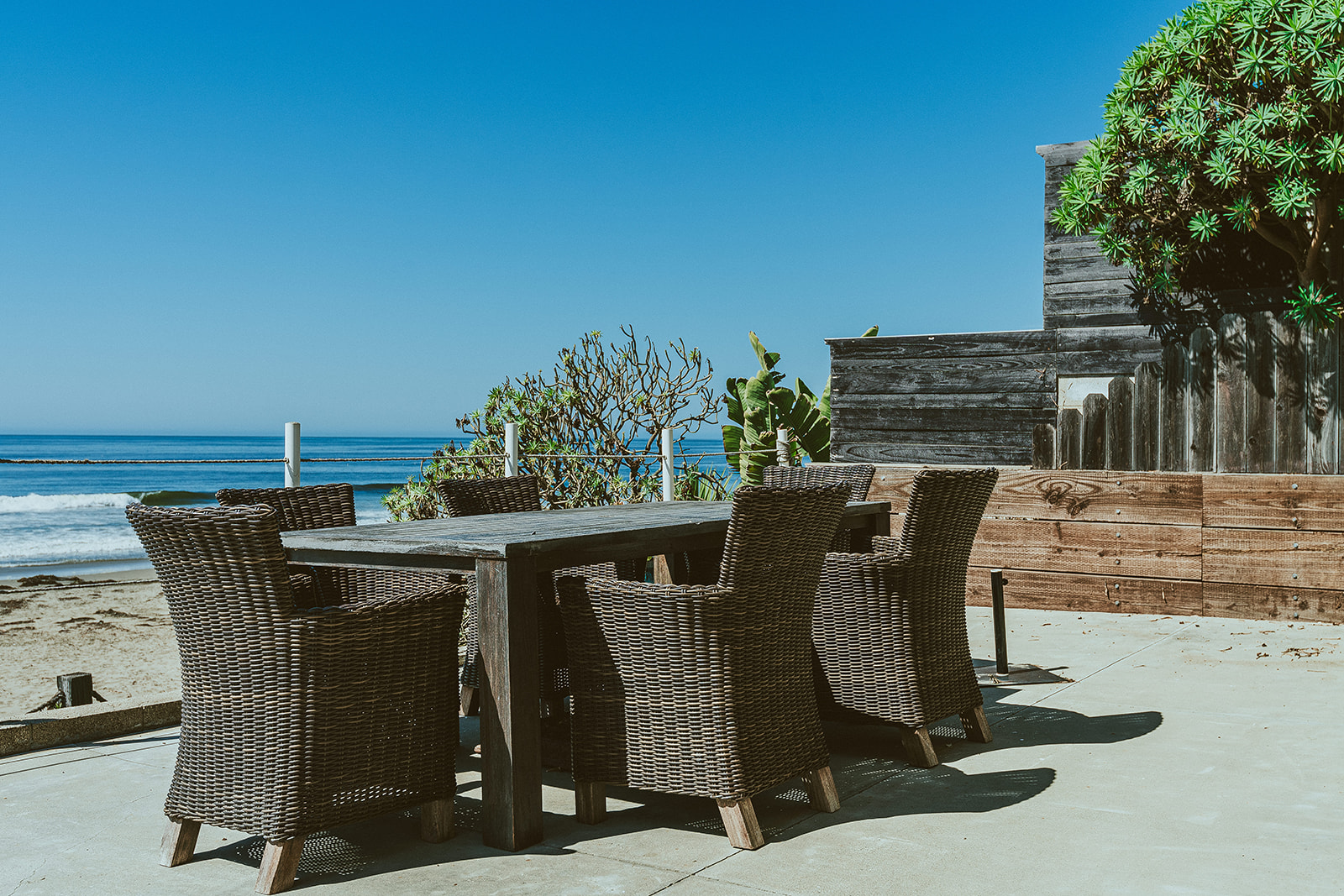 Oceanfront patio and dining area at a Pismo Beach vacation rental